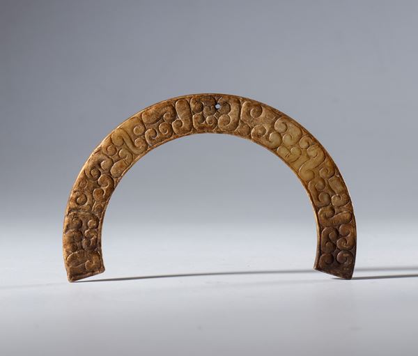 A Hotan jade crescent-shaped ornamental pendant in the style of the Han Dynasty (206 BC to 220 AD). China, Ming Dynasty (1368–1644), 16th century.