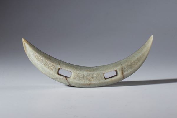 A large Hotan jade instrument engraved with archaic alphabet. China, 16th century