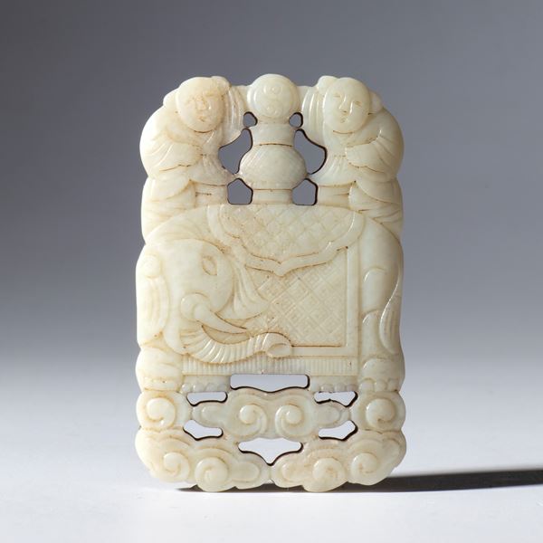 A pendant in light Hotan jade, pierced and engraved with figures of children, an elephant, and clouds. China, Qing Dynasty (1644–1912), 19th century.