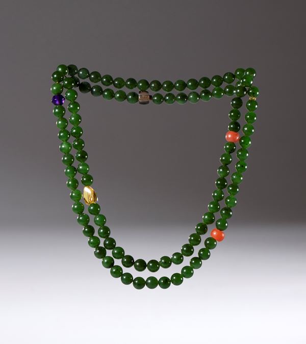 Mala composed of 108 green jade, carnelian, amethyst, smoky quartz, and citrine beads. China, Qing Dynasty (1644-1912), 19th century.