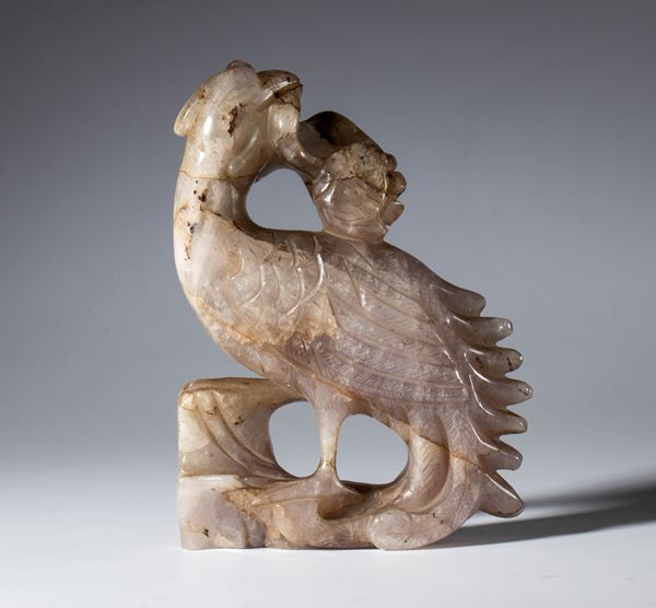 Carved and engraved amethyst sculpture depicting a bird with fruit in its beak. China, 20th century.