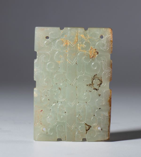 Rectangular engraved jade plaque, with holes in the corners for hanging or hanging. China, Qing Dynasty (1644-1912), late 19th century.