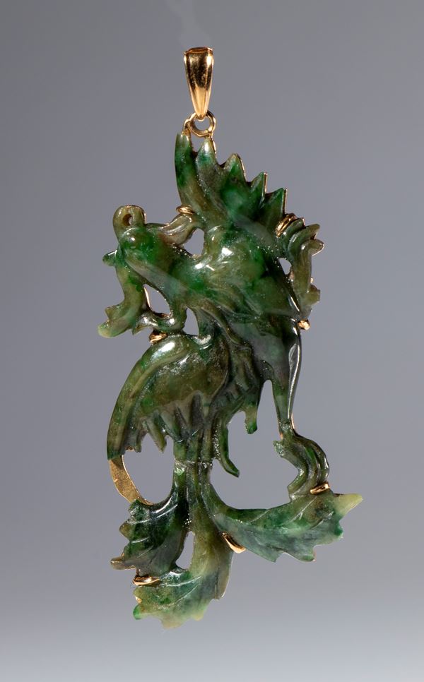 Dark green jade pendant with 18 K gold setting. China