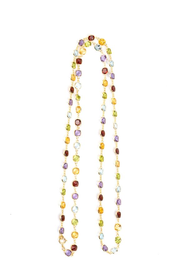 Collana in oro e pietre di colore 