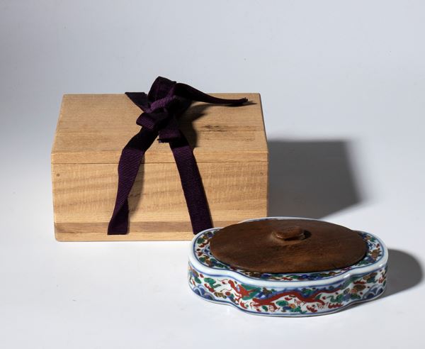 Wucai porcelain inkwell with wooden lid. Comes with its own wooden box. China, late 19th century.