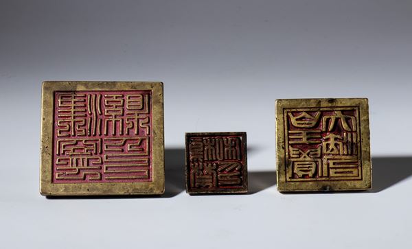 Group of three metal seals. China, 19th century.