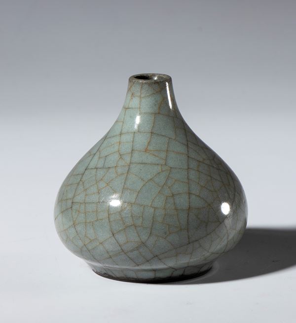 A small, craquelure-glazed celadon ceramic vase. China, 20th century.