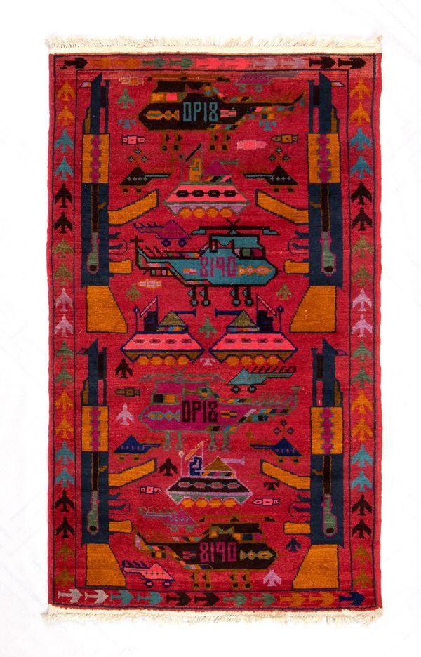 War rug. Colored wool and cotton. Afghanistan, ca. 1990.