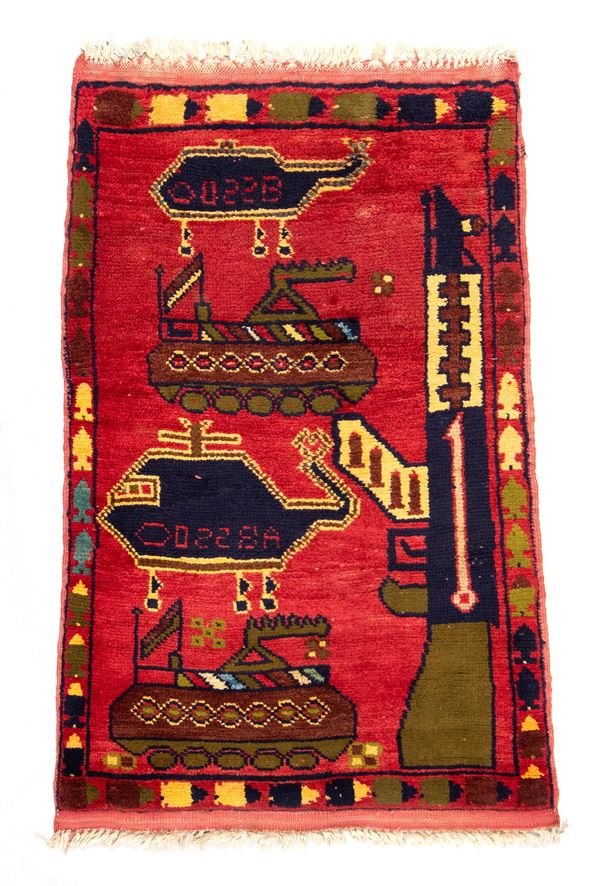 War rug. Colored wool and cotton. Afghanistan, ca. 1990.