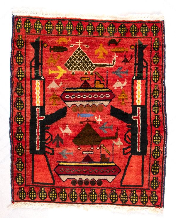 War rug. Colored wool and cotton. Afghanistan, ca. 1990.