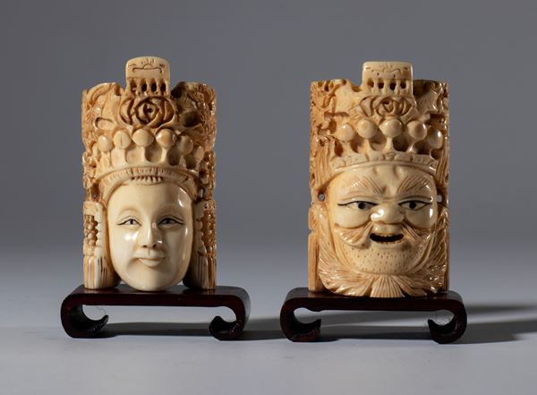 A pair of small elephant ivory masks depicting Chinese theater characters. China, 20th century.