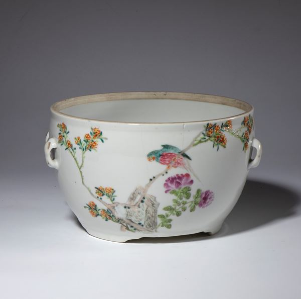A four-handled porcelain container painted with a flowering branch and a parrot. Calligraphy on the back. China, Republic period, 1912-1949.