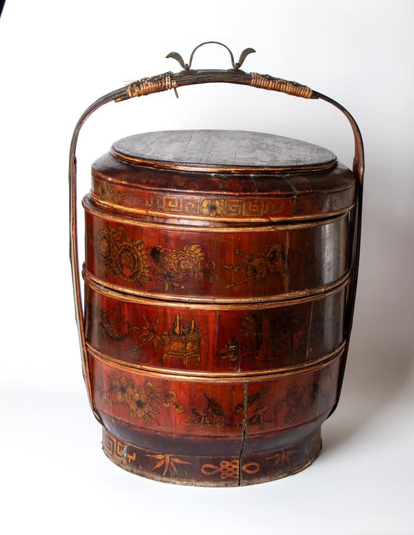 Lacquered and painted wooden food carrier. China, 19th century.