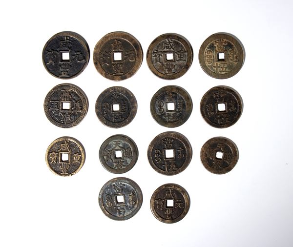 Lot of fourteen copper alloy coins. China, 20th century.