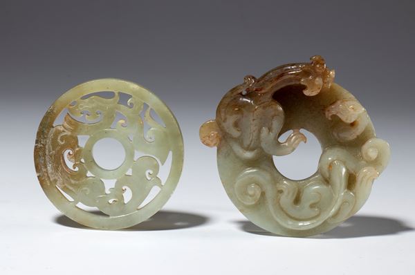A pair of BI discs in gray-green and russet jade. China, 20th century.