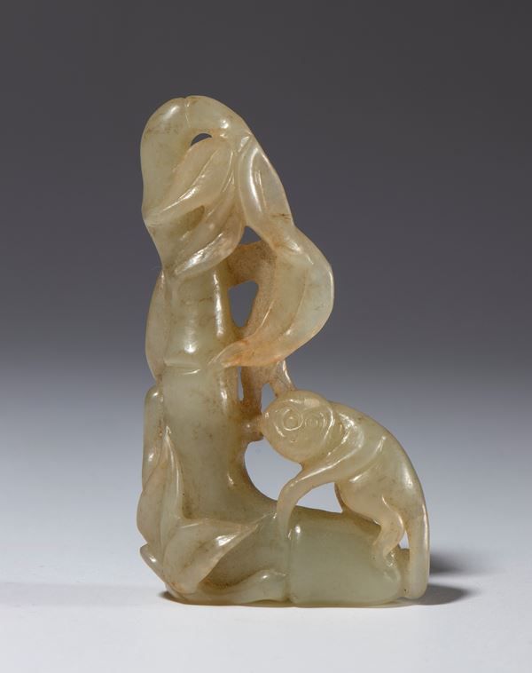 A refined Hotan jade sculpture depicting a pair of monkeys on bamboo. China, 20th century.