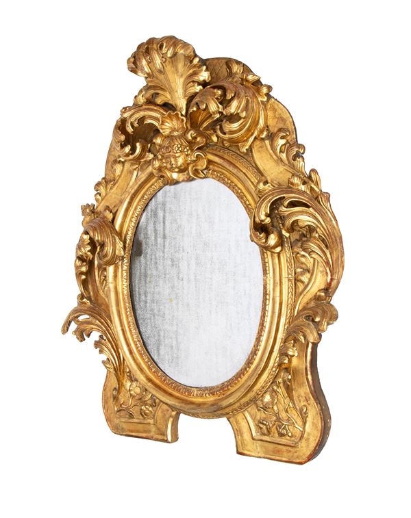 Carved and gilded wooden mirror