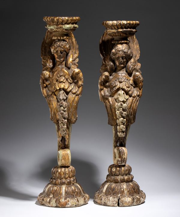 Pair of gilded wooden candlesticks