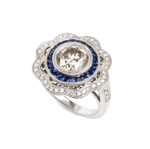 Anello in platino con diamanti e zaffiri     