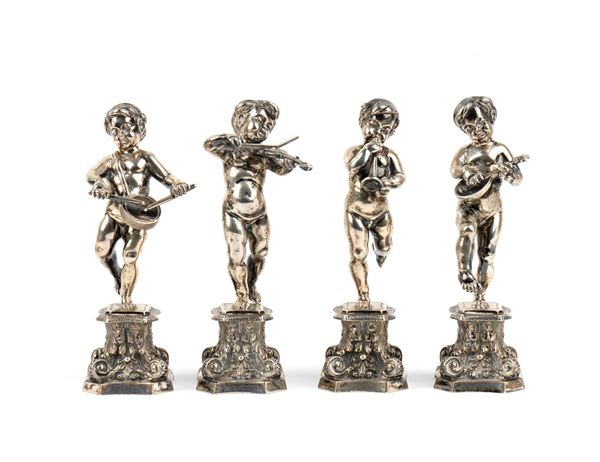 FASSI ARNO - Quattro sculture italiane in argento raffiguranti Putti