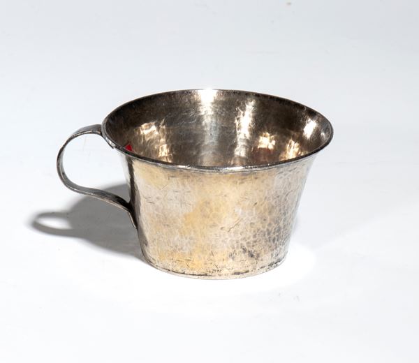 A silver-plated metal cup with a handle. Tibet, 20th century.