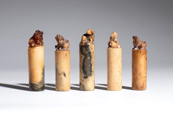 A multiple lot of five carved stone seals with zodiac animal-shaped knobs. China, late 19th-20th century.