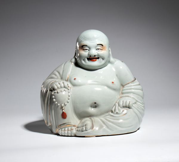 A white porcelain figure depicting Budai. China, early 20th century.