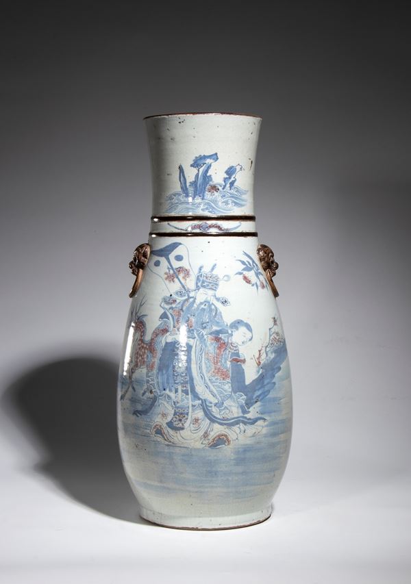 A baluster-shaped porcelain vase painted with polychrome enamels depicting a dignitary and a female figure. China, late Qing Dynasty, 20th century.