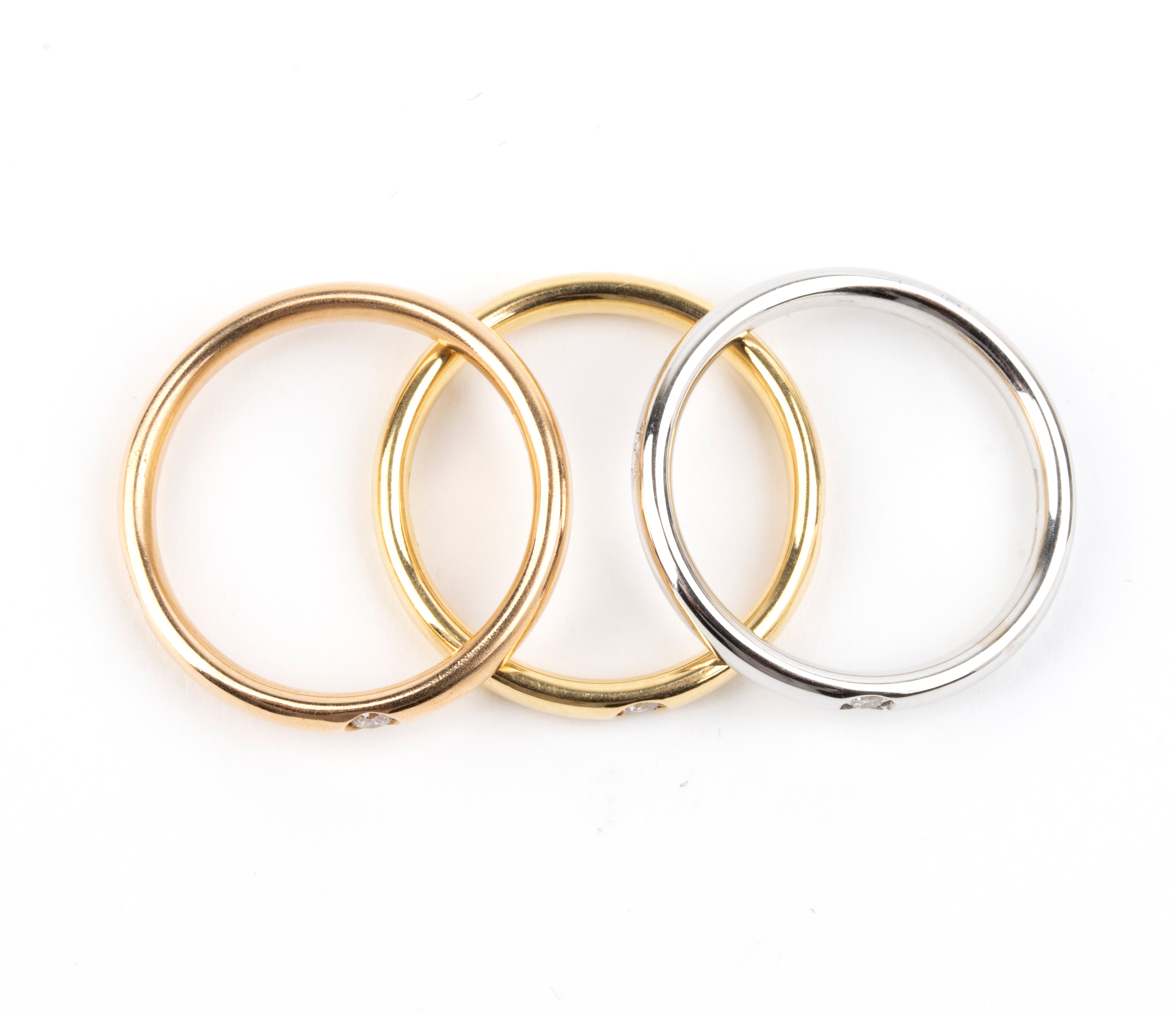 Pomellato - Collezione Lucciole: tre anelli in oro 18k con diamanti