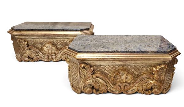 Pair of gold-colored wall shelves with drawers