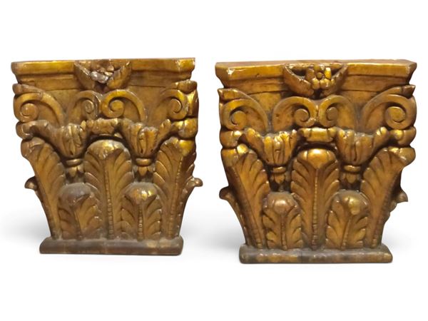 Pair of gilded corinthian capitals