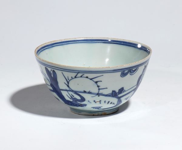 A blue and white porcelain bowl depicting scholars in a garden. China, Transition Period (1620-1683).