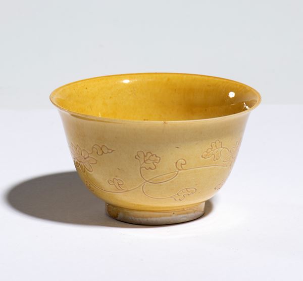 A yellow-glazed porcelain bowl with a six-character 
