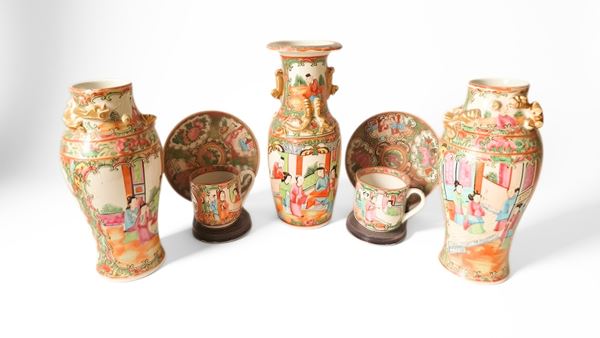 A group of Canton vases and plates decorated with polychrome enamels depicting scenes of courtly life. China, mid-20th century.