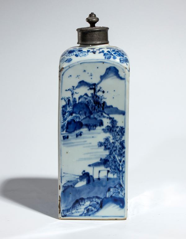 A square blue and white porcelain bottle decorated with classical pavilions, figures, and naturalistic scenes, with a knob-shaped stopper. China, Qing Dynasty, Kangxi Period. 
