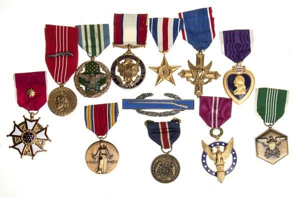 LOT OF 11 MEDALS AND A SHOOTER BADGE...