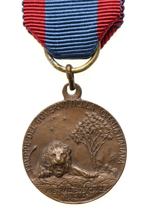 MEDAGLIA COMMEMORATIVA PER LE TRUPPE DEL GOVERNO DELLA TRIPOLITANIA...  - Auction La collezione Clodomiro Tavani di medaglie, onorificenze e ordini cavallereschi - Bertolami Fine Art - Casa d'Aste