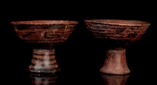 TWO PAINTED POTTERY STEM BOWLS