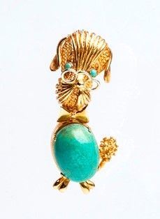 Spilla raffigurante un cane in oro e turchese...  - Asta Gioielli, argenti, orologi, avori e cabinet de curiosités - Bertolami Fine Art - Casa d'Aste