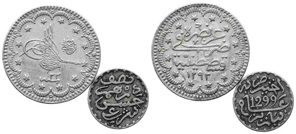 ESTERE. Interessante lotto di due monete islamiche: 1/2 dirham 1299/1882. Ag. B...  - Auction Monete e medaglie moderne Italiane ed Estere - Bertolami Fine Art - Casa d'Aste