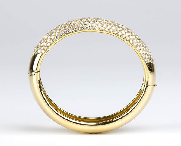 DAMIANI: bracciale a cerchio rigido in oro e diamanti 