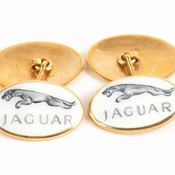 Pair of gold and enamel cufflinks depicting the car brand JAGUAR...