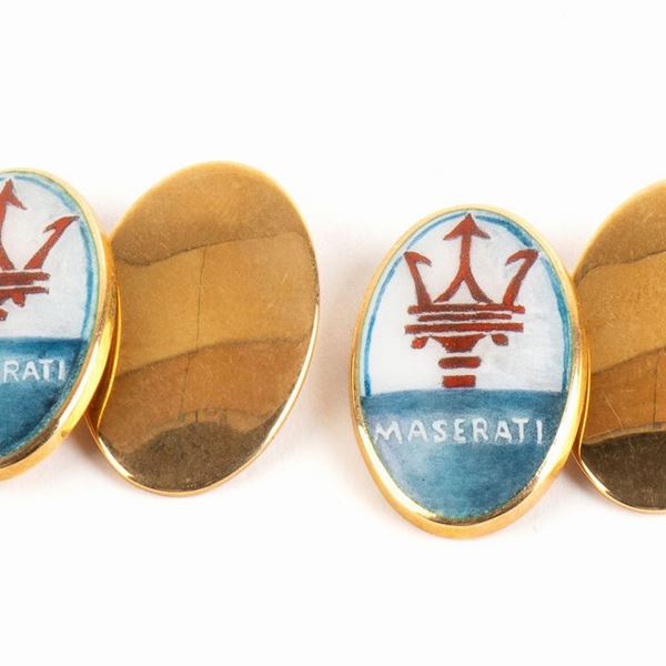 Pair of gold and enamel cufflinks depicting the car brand MASERATI...