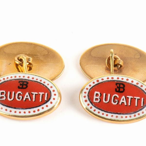Pair of gold and enamel cufflinks depicting the car brand BUGATTI...