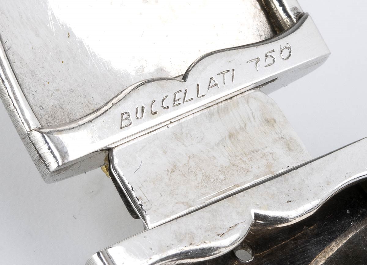 MARIO BUCCELLATI: bracciale a fascia rigida e paio di orecchini in oro e diamanti