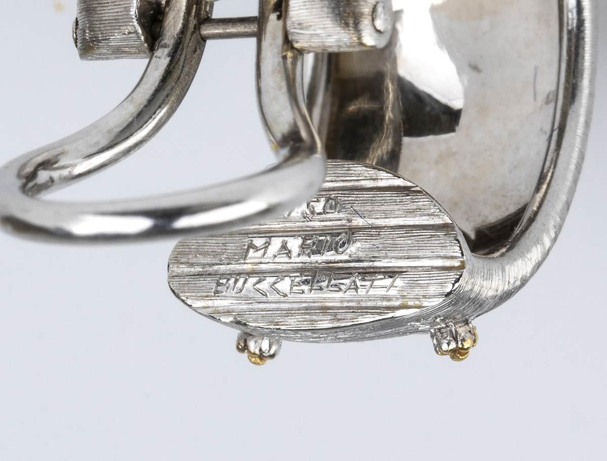 MARIO BUCCELLATI: bracciale a fascia rigida e paio di orecchini in oro e diamanti