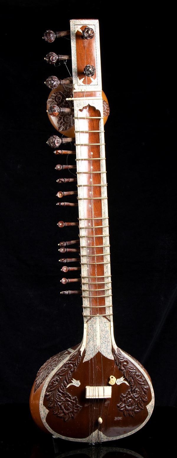 AN IVORY AND MOTHER-OF-PEARL INLAID WOOD SITAR 